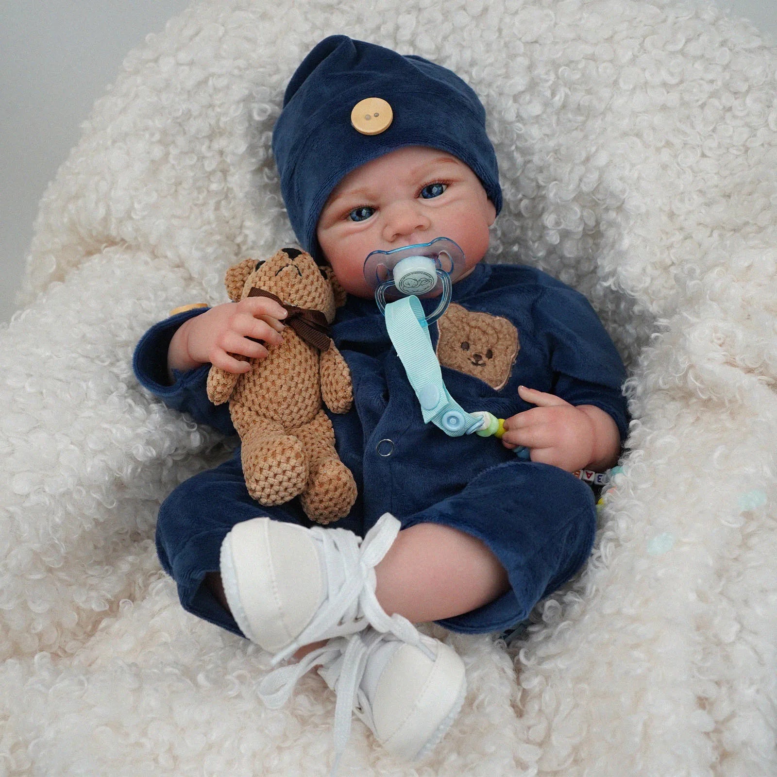 Bebê reborn Menino recem nacido de silicone com olhos azuis 48cm - Gael